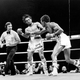 Duran takes a punch from Leonard during their first title fight. Photo credit: AP